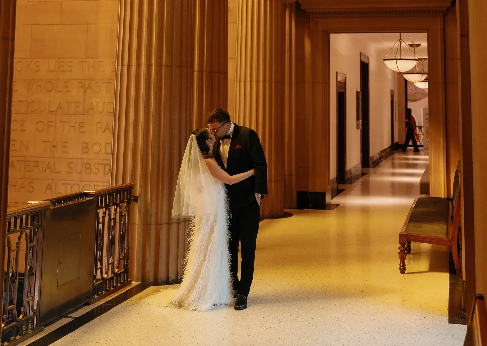 Bride and groom sharing an intimate moment in elegant hallway